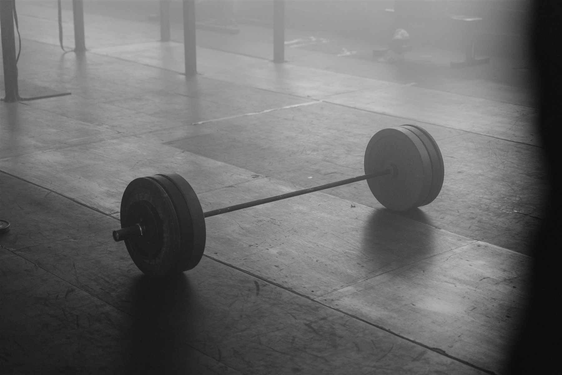 Barbell on a foggy gym floor